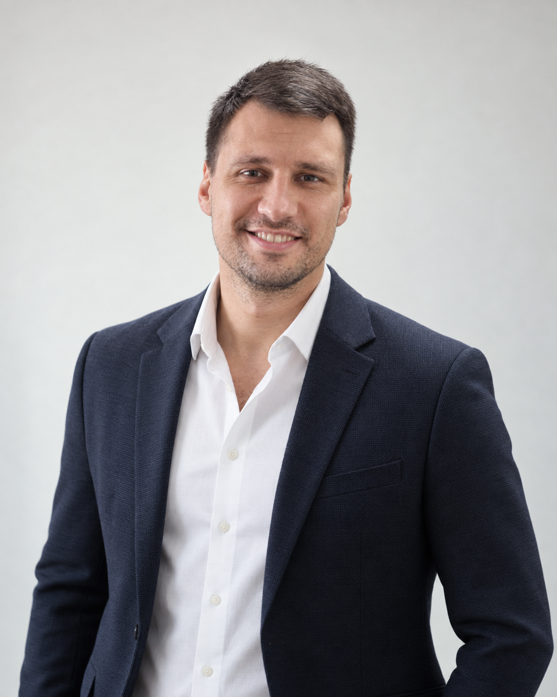 Maksim Ogoreltcev in a navy blazer